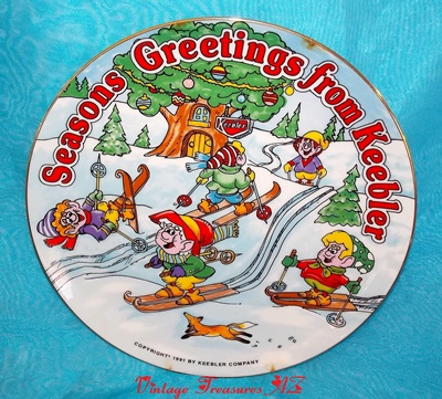 Image for   Keebler Elves Seasons Greetings from Keebler 1991 Christmas Plate Snow Skiing Elf Advertising Mascots Hollow Tree Factory Tree House Winter Holidays     ***USPS PRIORITY MAIL SHIPPING INCLUDED – DOMESTIC ORDERS ONLY!***